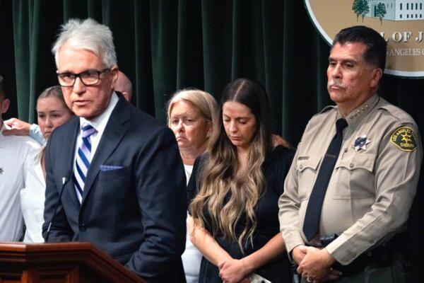 Los Angeles County Sheriff Robert Luna (R) looks on as Los Angeles County District Attorney George Gascon makes an announcement in charges in the killing of sheriff's deputy Ryan Clinkunbroomer at the Hall of Justice in downtown Los Angeles on Sept. 20, 2023. (AP Photo/Richard Vogel)