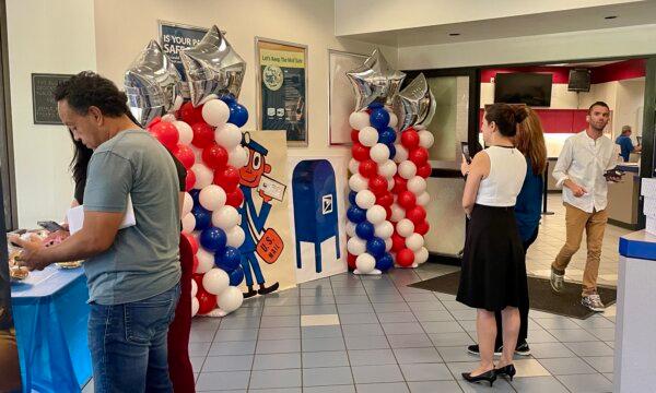 Local residents gather at Irvine Harvest Station post office to grab a copy of a commemorative postmark in Irvine, Calif., on Sept. 26, 2023. (Carol Cassis/The Epoch Times)
