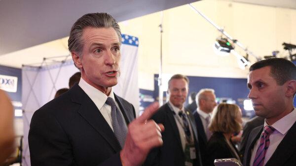 California Gov. Gavin Newsom talks to reporters in the spin room following the FOX Business Republican Primary Debate at the Ronald Reagan Presidential Library in Simi Valley, Calif., on Sept. 27, 2023. (Mario Tama/Getty Images)