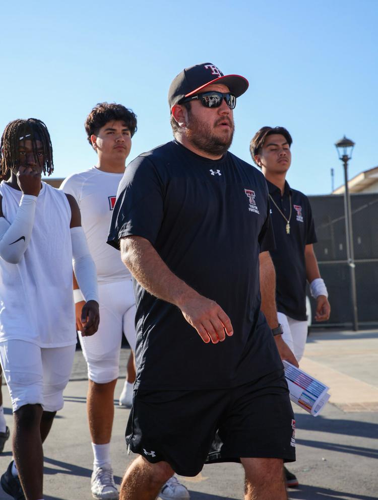 Coach Anthony Lopez (C) with football team members from Tustin High School in Orange County, California. (Courtesy of Caesar Ocular)