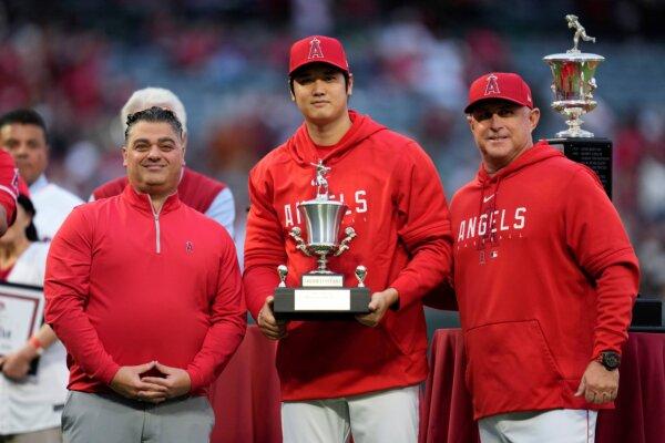 Los Angeles Angels' Shohei Ohtani (C), poses with general manger Perry Minasian (L), and manager Phil Nevin after accepting the team's Most Valuable Player Award before a baseball game against the Oakland Athletics in Anaheim, Calif., on Sept. 30, 2023. (Ashley Landis/AP Photo)