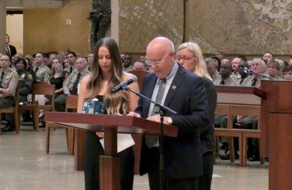 Slain Los Angeles Deputy Ryan Clinkunbroomer's father (C), Michael, speaks at his funeral services at the Cathedral of our Lady of the Angels in Los Angeles on Oct. 5, 2023. (Los Angeles County Sheriff's Department/Screenshot via The Epoch Times)
