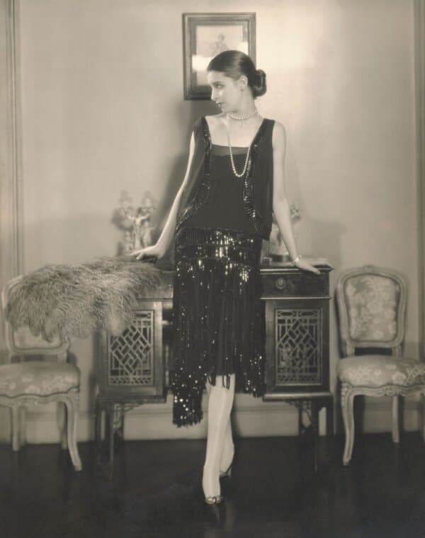 American model Marion Morehouse, wearing a black crepe romain bolero dress with fringed and paillette embroidered skirt by Chanel. Published in Vogue US, 1926. Photograph by Luxembourgish American photographer Edward Steichen. (Edward Steichen/Condé Nast/Shutterstock)