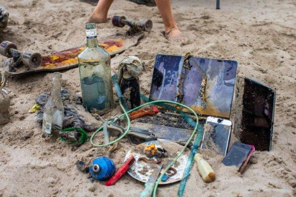 Electronic devices found in the ocean by divers who were volunteering to pick up trash on the beach during International Coastal Cleanup Day in Santa Monica, Calif., on Sept. 17, 2022. (Apu Gomes/AFP via Getty Images)