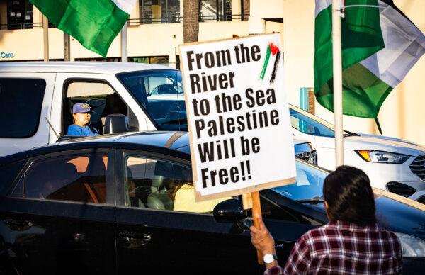 Protesters wave Palestinian flags in support of Palestinians, in Los Angeles on Oct. 12, 2023. (John Fredricks/The Epoch Times)