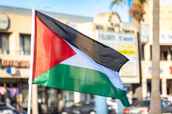 A Palestinian flag is waved at a rally in support of Palestinians, in Los Angeles on Oct. 12, 2023. (John Fredricks/The Epoch Times)