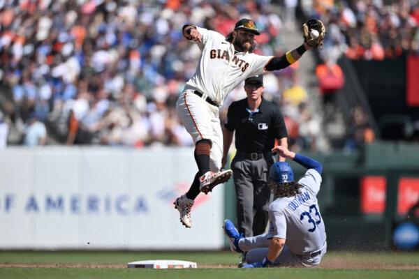 James Outman (33) of the Los Angeles Dodgers steals second base over Brandon Crawford (35) of the San Francisco Giants in the fifth inning at Oracle Park in San Francisco on Oct. 1, 2023. (Brandon Vallance/Getty Images)