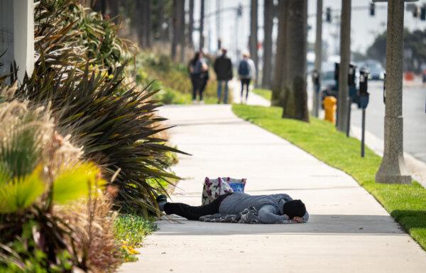A homeless man in Huntington Beach, Calif., on March 17, 2023. (John Fredricks/The Epoch Times)