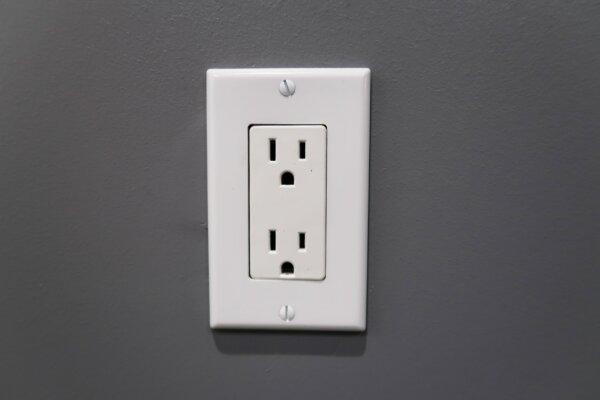 A file photo of a wall power outlet. (Sophie Li/The Epoch Times)