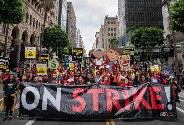 Hotel workers march in the streets of downtown Los Angeles on Oct. 25, 2023. (John Fredricks/The Epoch Times)