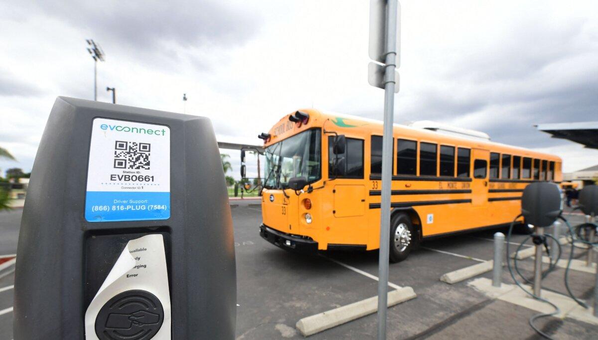 A new EV school bus from an all-electric fleet is parked beside charging stations at South El Monte High School in El Monte, Calif., on Aug. 18, 2021. (Frederic J. Brown/AFP via Getty Images)