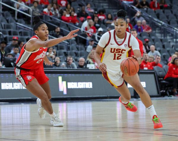 JuJu Watkins (12) of the USC Trojans drives against Taylor Thierry (2) of the Ohio State Buckeyes in the second half of their game during the Naismith Basketball Hall of Fame Series at T-Mobile Arena in Las Vegas on Nov. 6, 2023. The Trojans defeated the Buckeyes 83–74. (Ethan Miller/Getty Images)