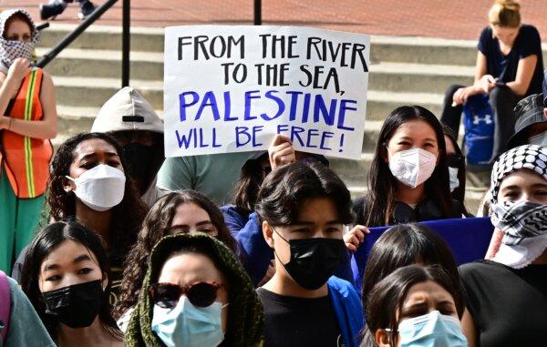 A participant holds a placard as students gather during a "Walkout to fight Genocide and Free Palestine" at Bruin Plaza at the University of California in Los Angeles on Oct. 25, 2023. (Frederic J. Brown/AFP via Getty Images)