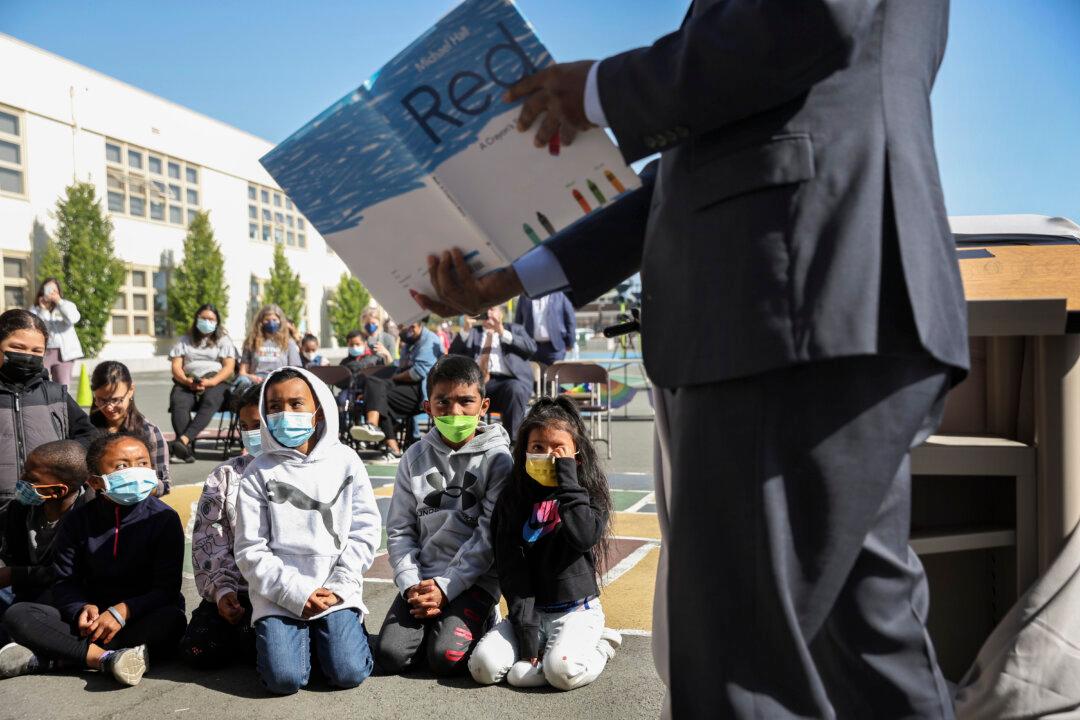 California State Superintendent of Schools Tony Thurmond reads “Red: A Crayon's Story” to second graders at Nystrom Elementary School in Richmond, Calif., on May 17, 2022. Clinics in California, a state considered a haven for transgender-related care, have recently announced changes to treatments for minors. (Justin Sullivan/Getty Images)