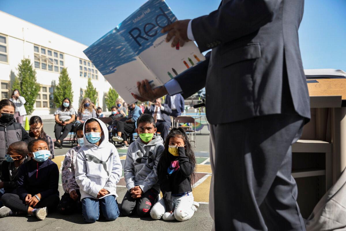California State Superintendent of Schools Tony Thurmond reads from the book "Red: A Crayon's Story" to second-grade students at Nystrom Elementary School in Richmond, Calif., on May 17, 2022. (Justin Sullivan/Getty Images)