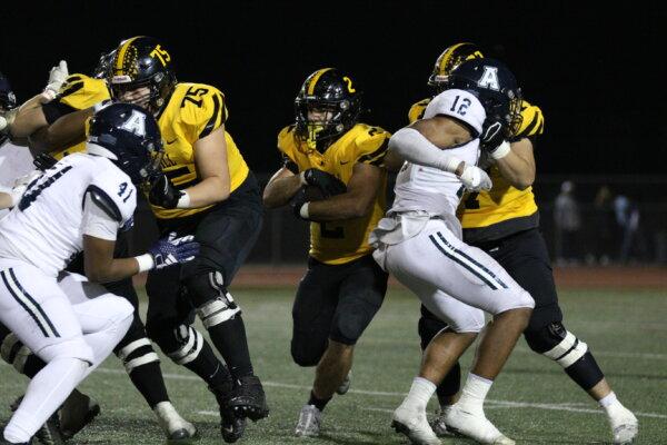 Senior running back Aaron Mitchell (No. 2) runs with the ball for Foothill High School’s football team in a recent game. (Courtesy of Gary Cunningham)