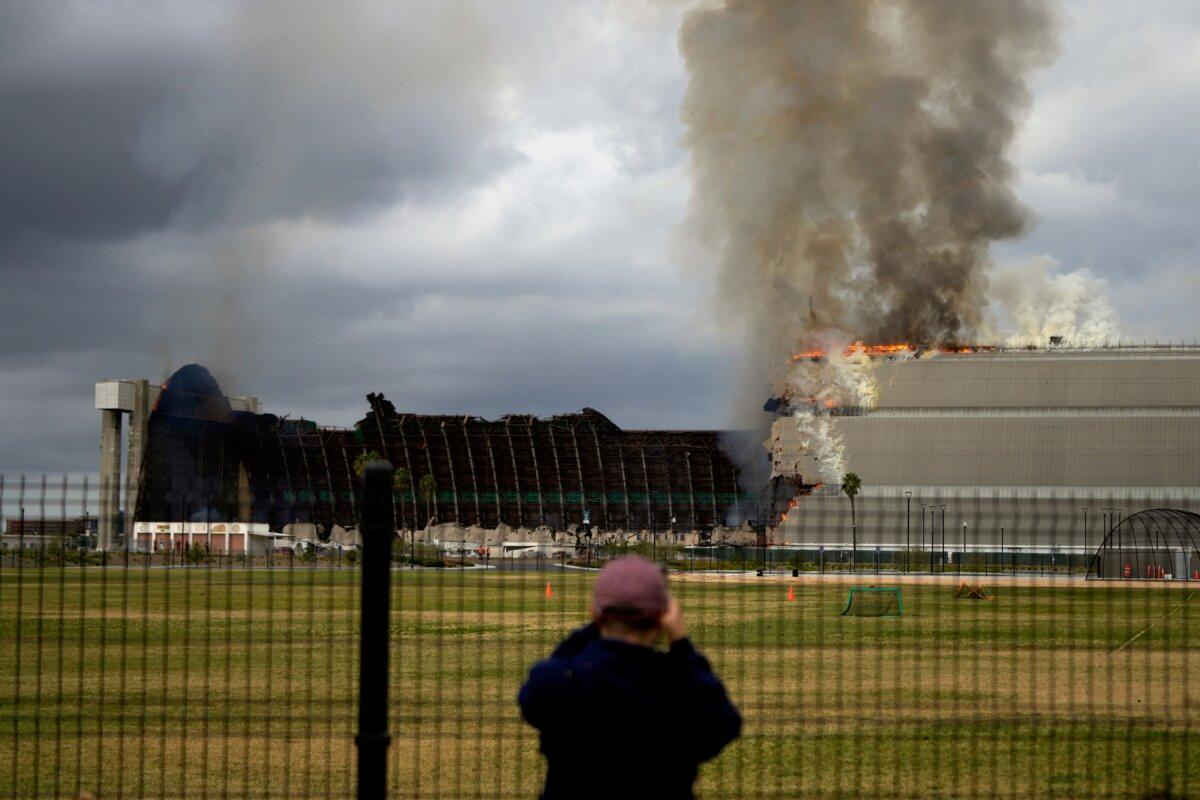 A historic blimp hangar burns in Tustin, Calif., on Nov. 7, 2023. (Jae C. Hong/AP Photo)