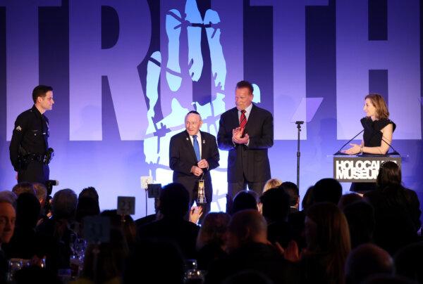 (L-R) LAPD's Gabe Cohen, 101-year-old Holocaust survivor Joe Alexander, Arnold Schwarzenegger, and Holocaust Museum LA CEO Beth Kean onstage during the Holocaust Museum LA gala honoring Arnold Schwarzenegger with first Award of Courage at The Beverly Hills Hotel in Beverly Hills, Calif., on Nov. 06, 2023. (Phillip Faraone/Getty Images for Holocaust Museum LA)