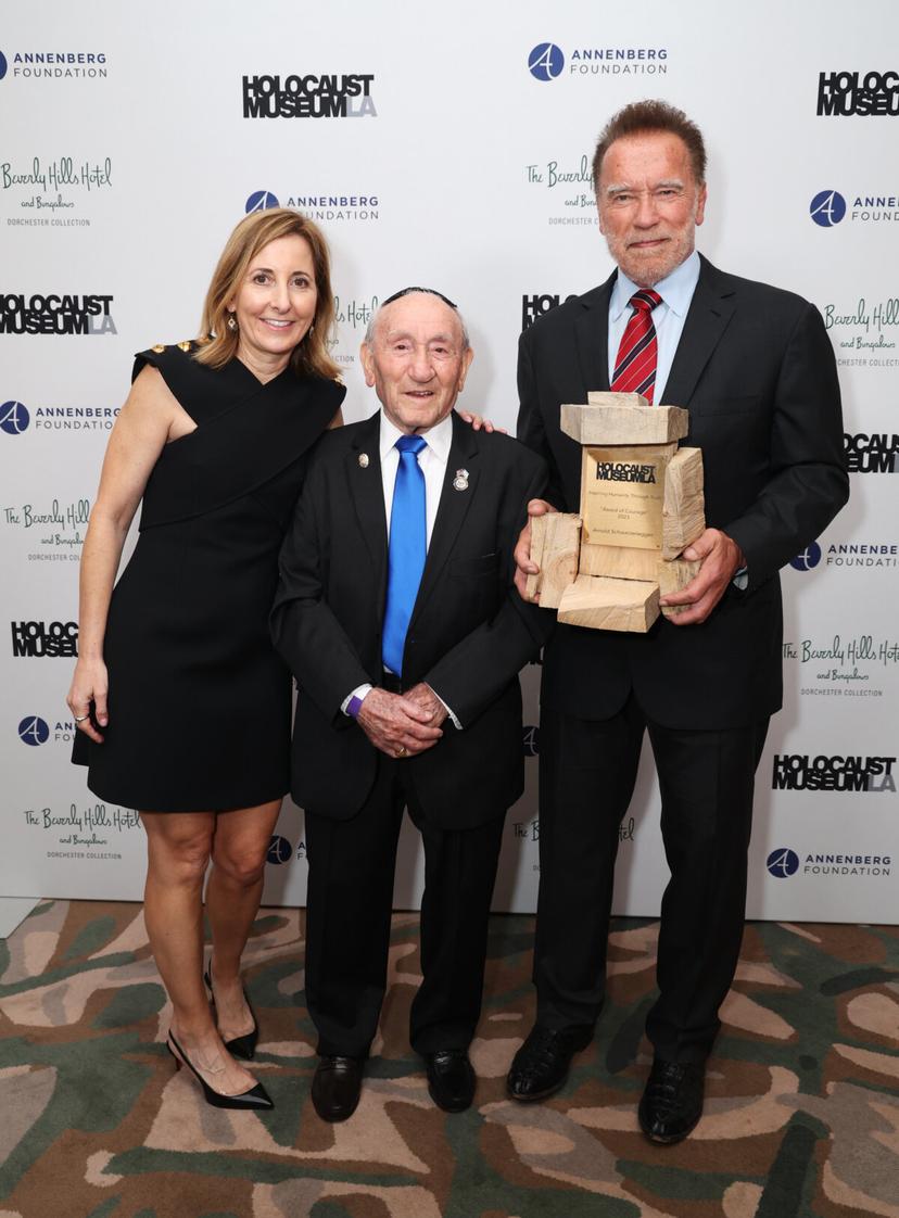 (L-R) Holocaust Museum LA CEO Beth Kean, 101-year-old Holocaust survivor Joe Alexander, and Arnold Schwarzenegger attend the Holocaust Museum LA gala at The Beverly Hills Hotel in Beverly Hills, Calif., on Nov. 06, 2023. (Phillip Faraone/Getty Images for Holocaust Museum LA)
