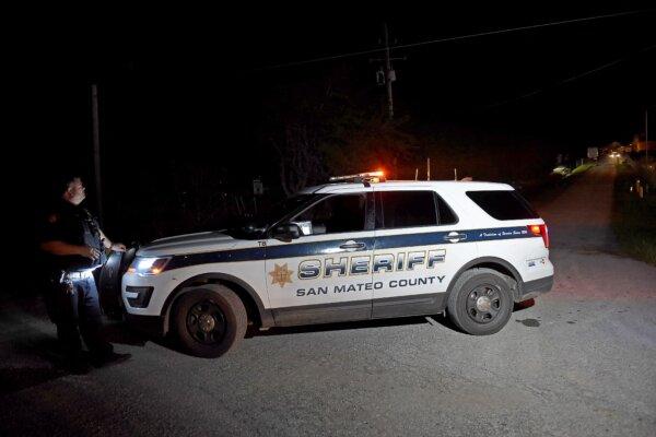A San Mateo County sheriff deputy stands guard at a crime scene in Half Moon Bay, Calif., on Jan. 23, 2023. (Susana Bates/AFP via Getty Images)
