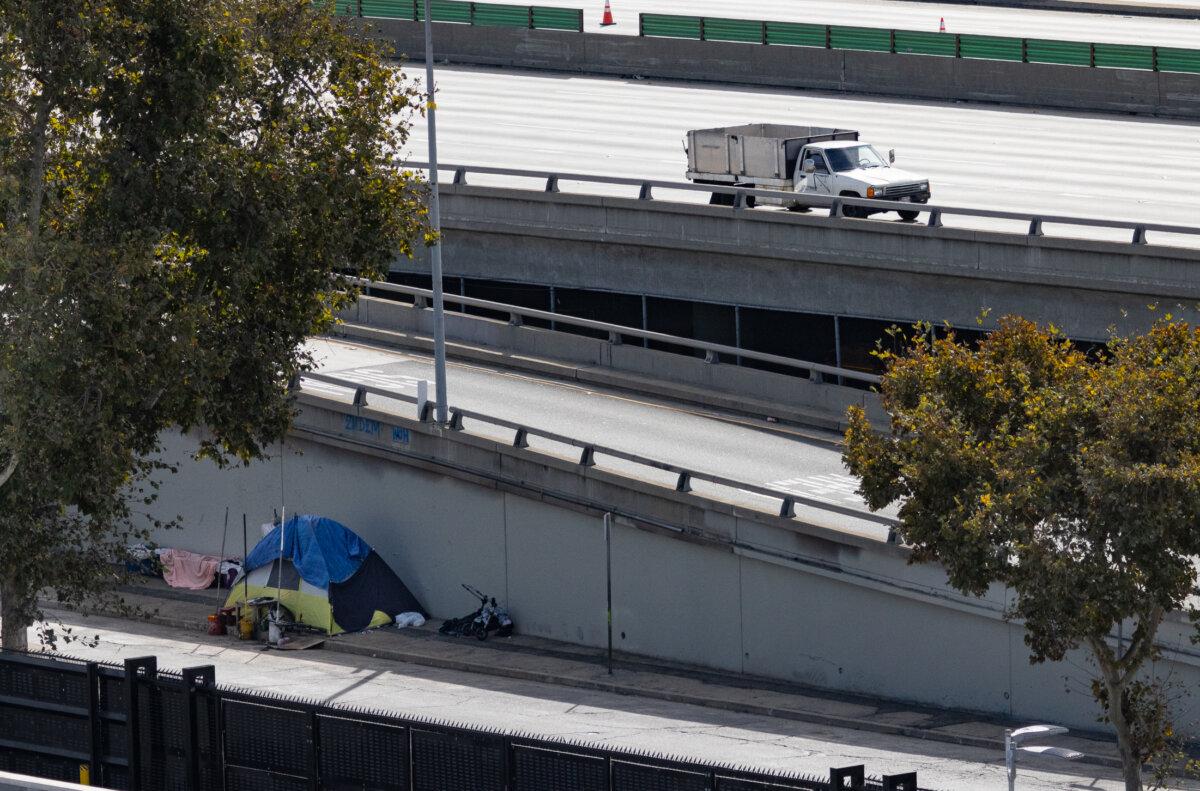 A homeless encampment sits off the closed 10 freeway in Los Angeles on Nov. 13, 2023. (John Fredricks/The Epoch Times)