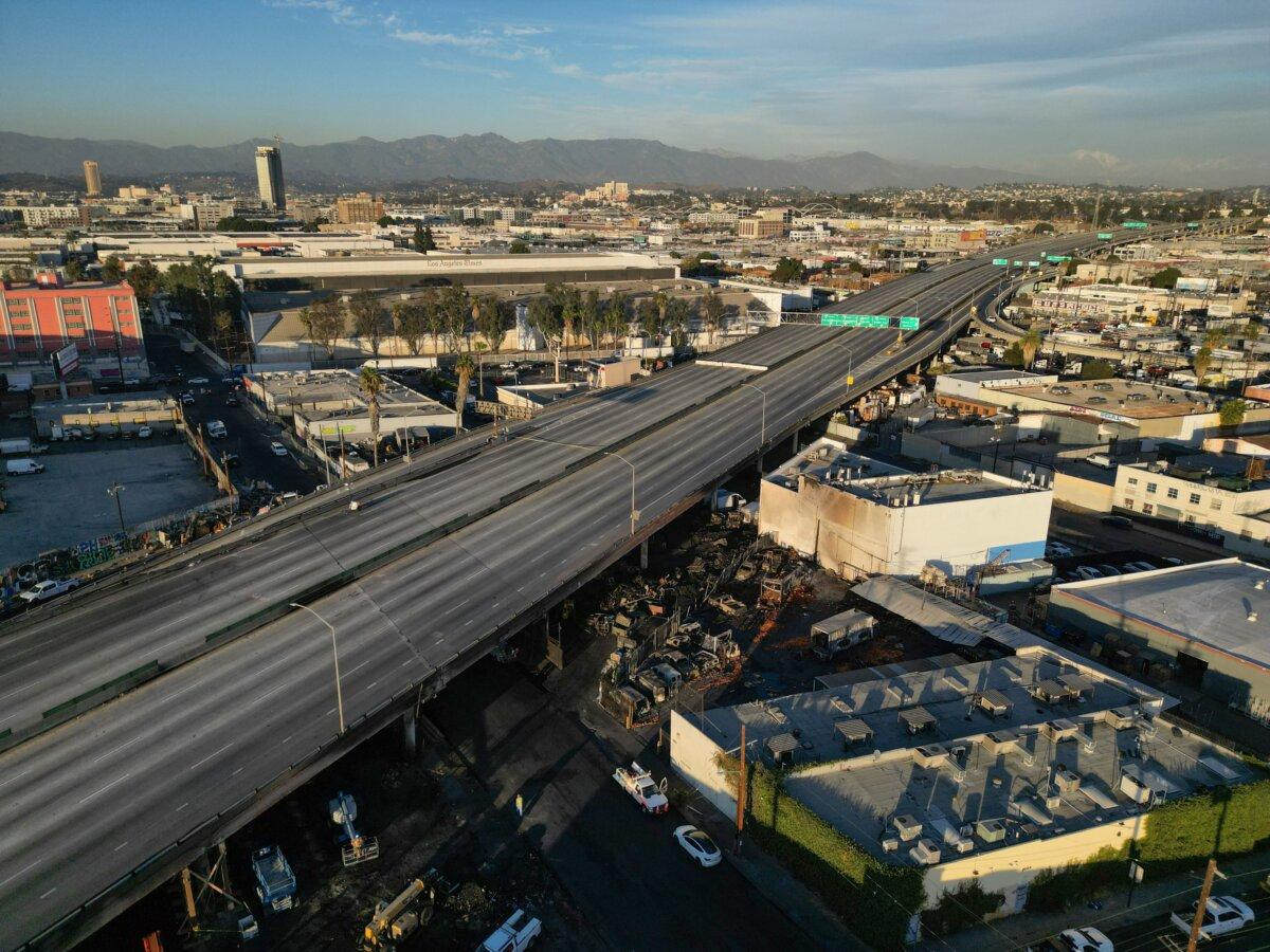 An aerial view of burnt cars and other debris under the I-10 freeway after a large fire led to the shutdown of the freeway, also called the Santa Monica Freeway, in both directions, in Los Angeles on Nov. 13, 2023. (Robyn Beck/AFP via Getty Images)