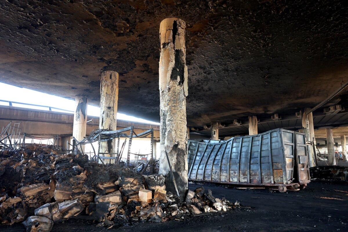 Fire damage is viewed beneath the closed I-10 elevated freeway following a large pallet fire, in Los Angeles, on Nov. 13, 2023. (Mario Tama/Getty Images)
