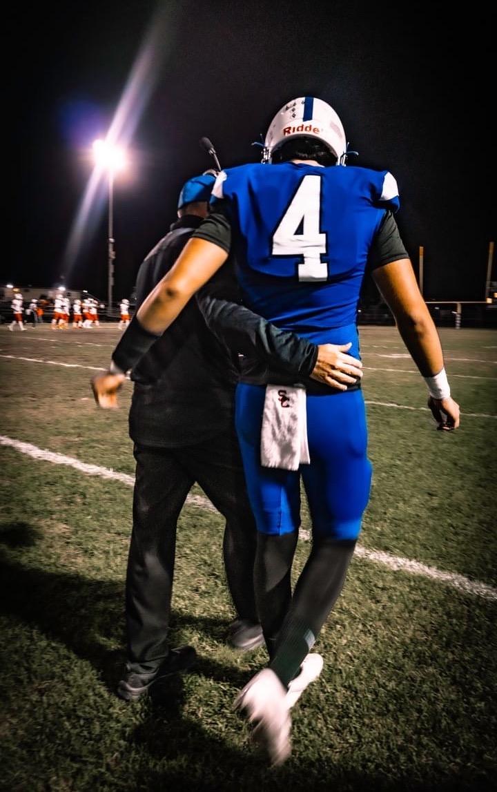 Western High School Coach Dan Davidson and Senior quarterback Anthony Luna (No. 4) at a recent game. (Courtesy of Jeff Kihara)