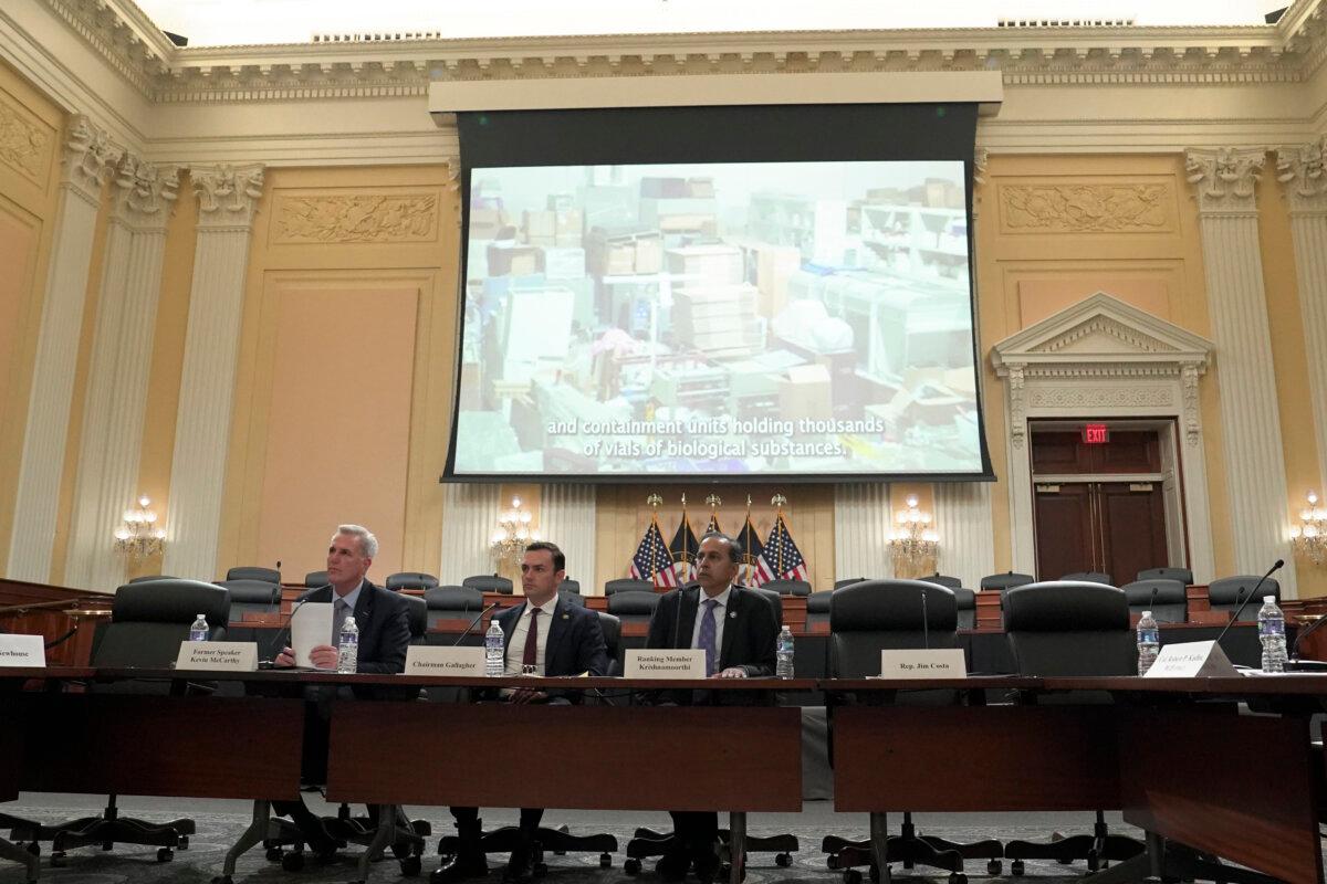 (L-R) Rep. Kevin McCarthy (R-Calif.), Rep. Mike Gallagher (R-Wis.), and Rep. Raja Krishnamoorthi (D-Ill.) watch a video during a press conference unveiling the results of the Select Committee on the Chinese Communist Party (CCP) investigation into the biolab discovered in Reedley, Calif., in Washington on Nov. 15, 2023. (Madalina Vasiliu/The Epoch Times)