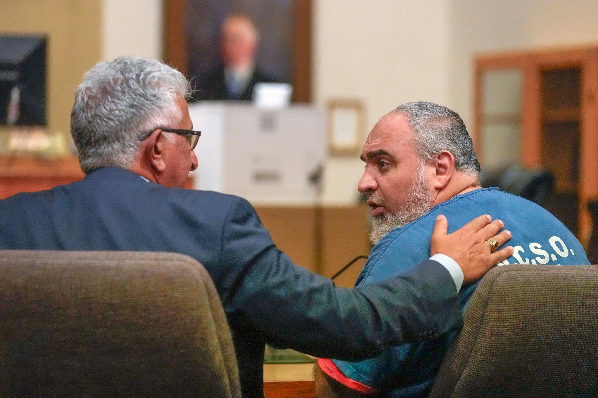 Attorney Ron Bamieh (L) talks to his client Loay Abdelfattah Alnaji, a professor of computer science at Moorpark College, during an appearance in Ventura County Superior Court in connection with the death of Paul Kessler in Ventura, Calif., on Nov. 17, 2023. (Damian Dovarganes/AP Photo)