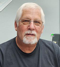 Craig Jacobsen, owner of Outboard Motor Shop, in Oakland, Calif., on Nov. 10, 2023. (Allan Stein/The Epoch Times)