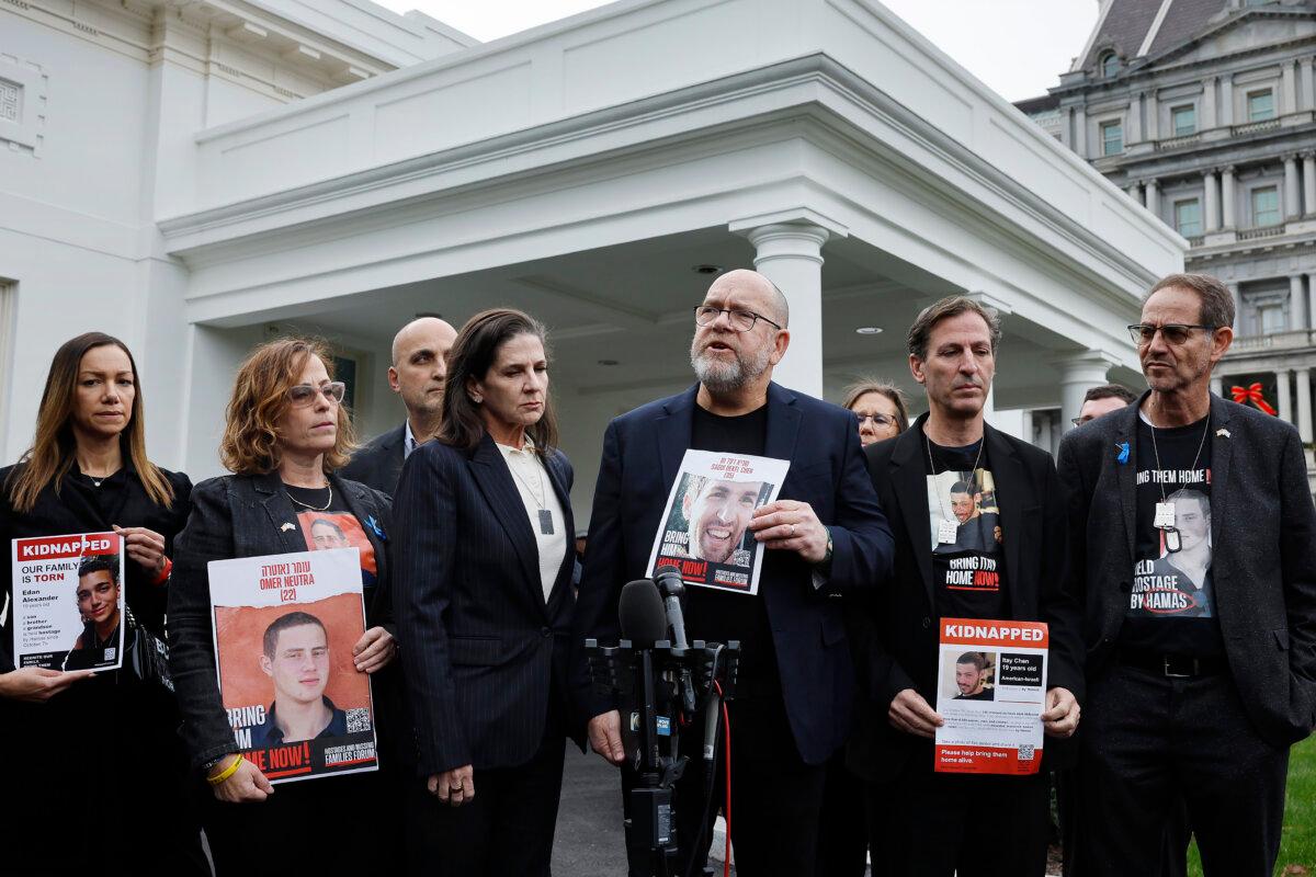 Family members of the Americans taken hostage by Hamas during the terrorist attacks in Israel on Oct. 7, including (R-L) Ronen Neutra, Ruby Chen, Jonathan Dekel-Chen, Liz Naftali, Adi Alexander, Orna Neutra, and Yael Alexander, talk to reporters outside the West Wing of the White House in Washington on Dec. 13, 2023. (Chip Somodevilla/Getty Images)