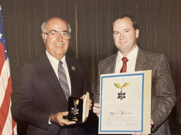 Michael Bornman, a retired Los Angeles County Sheriff’s Department captain, receives an award as a sergeant from then-Sheriff Sherman Block. (Courtesy of Michael Bornman)