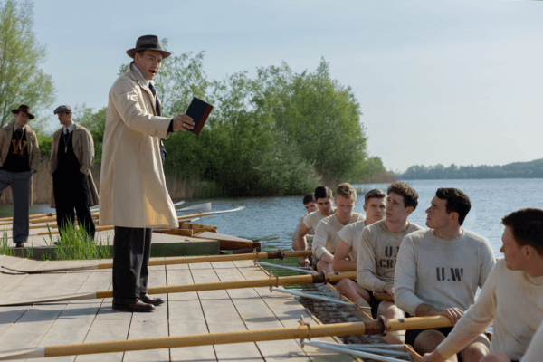 Coach Al Ulbrickson (Joel Edgerton, center) giving instructions, in “The Boys in the Boat.” (Laurie Sparham/Metro-Goldwyn-Mayer Pictures)
