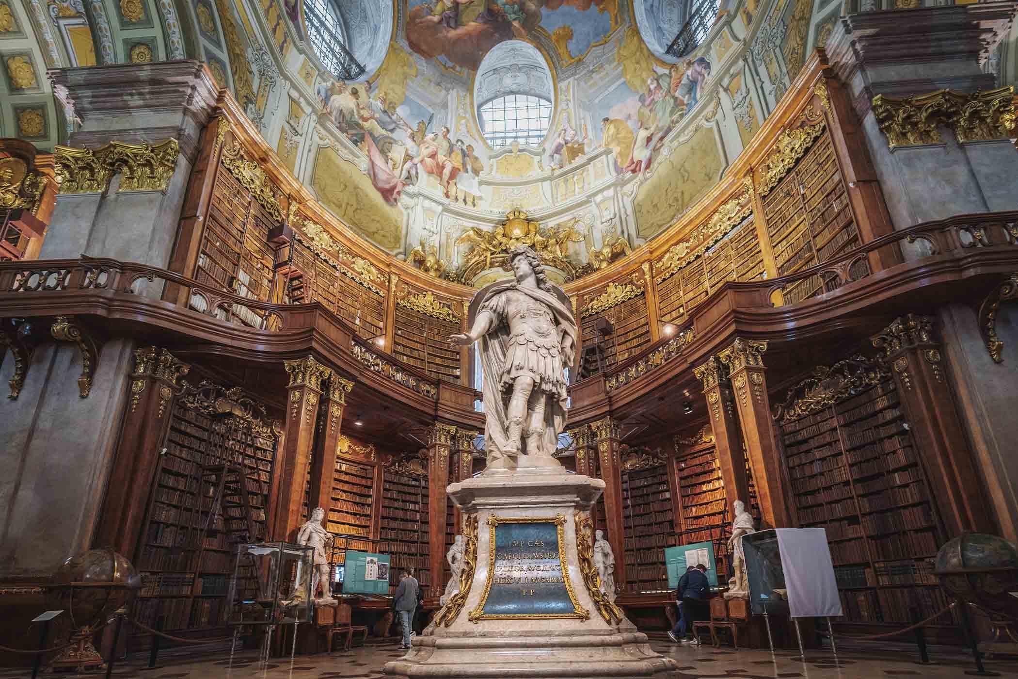 A statue of Emperor Charles VI inside the Austrian National Library's State Hall in Vienna, Austria. (Diego Grandi/Shutterstock)