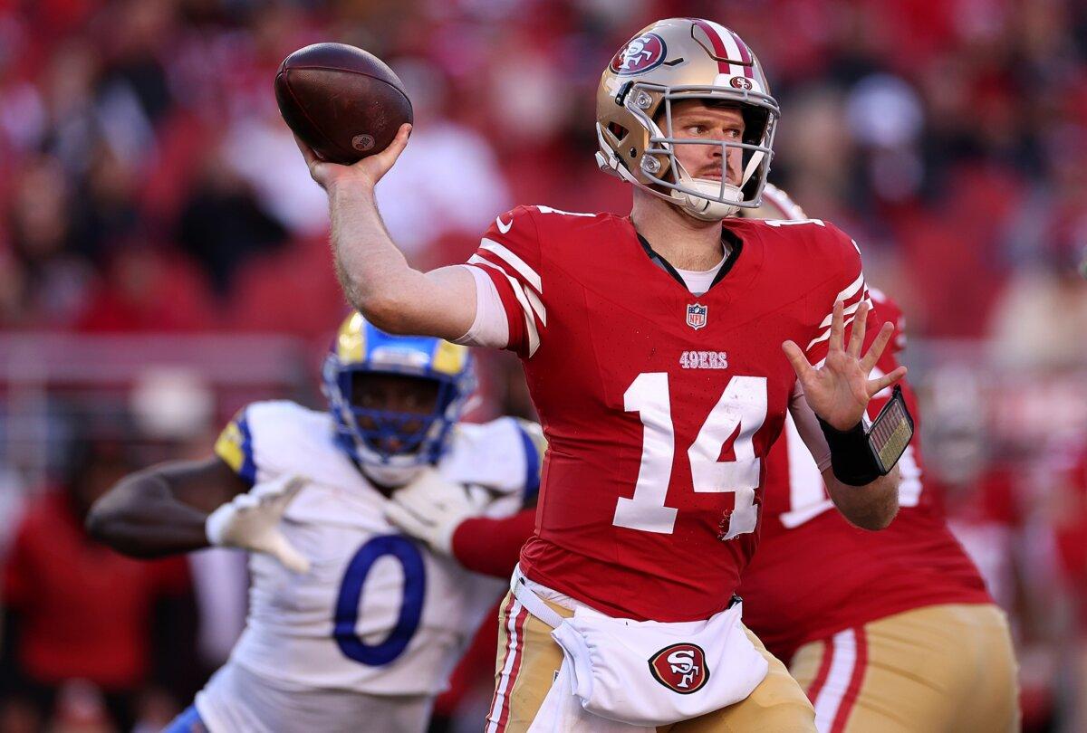 Sam Darnold (14) of the San Francisco 49ers looks to pass in the first half during a game against the Los Angeles Rams in Santa Clara, Calif., on Jan. 7, 2024. (Ezra Shaw/Getty Images)