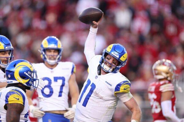 Carson Wentz (11) of the Los Angeles Rams celebrates after a rushing touchdown in the fourth quarter against the San Francisco 49ers in Santa Clara, Calif., on Jan. 7, 2024. (Ezra Shaw/Getty Images)