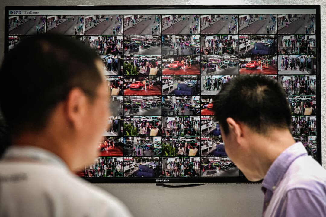 People are seen in numerous images from closed-circuit television security cameras, displayed on a screen at the World Artificial Intelligence Conference in Shanghai on July 6, 2023. (Wang Zhao/AFP via Getty Images)