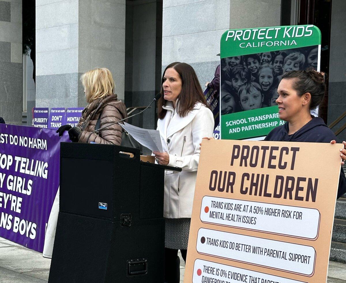 Erin Friday (C), an attorney who is on the executive committee for Protect Kids California, speaks at a press conference in Sacramento, Calif., on Jan. 3, 2024. (Courtesy of Jay Reed, Protect Kids California)