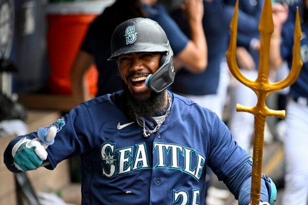 Teoscar Hernandez (35) of the Seattle Mariners celebrates with teammates after hitting a three-run home run during the third inning against the Oakland Athletics in Seattle on August 30, 2023. (Alika Jenner/Getty Images)