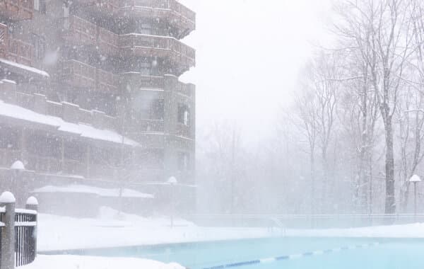 The outdoor heated pool features a swim-out entrance from an indoor heated area where you can store your robe and slippers. (Courtesy of the Spruce Peak Lodge)