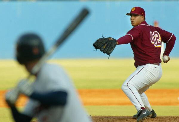 A baseball player for the USC Trojans throws a pitch against the Pepperdine Waves during the NCAA baseball regional game at Blair Field in Long Beach, Calif., on June 5, 2005. (Christian Petersen/Getty Images)