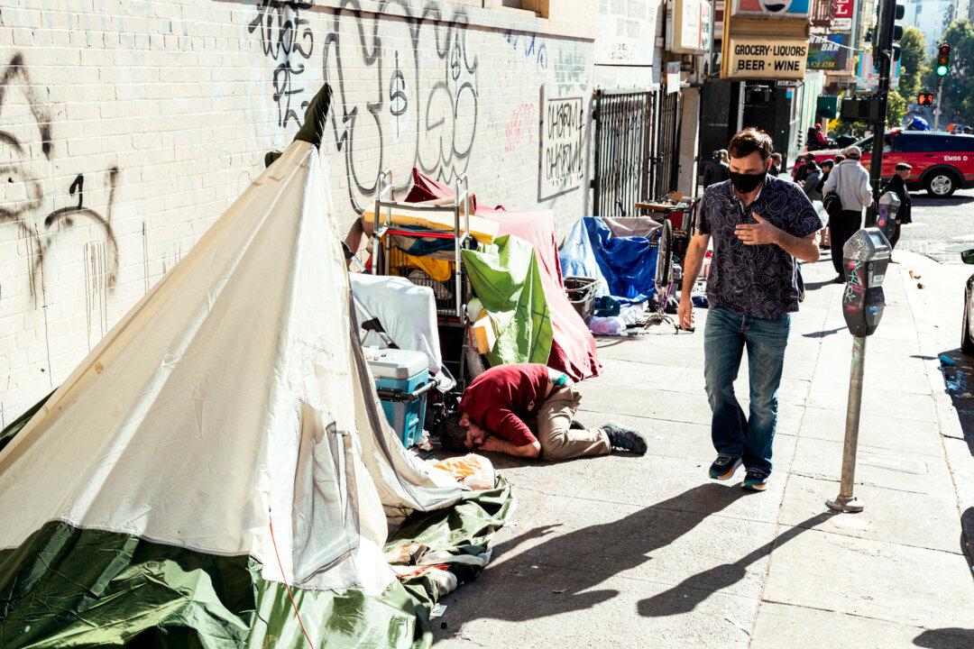 Homeless people on Jones Street in San Francisco on Nov. 13, 2023. Nearly 8,000 people now live on the streets in the city. (Jason Henry/AFP via Getty Images)