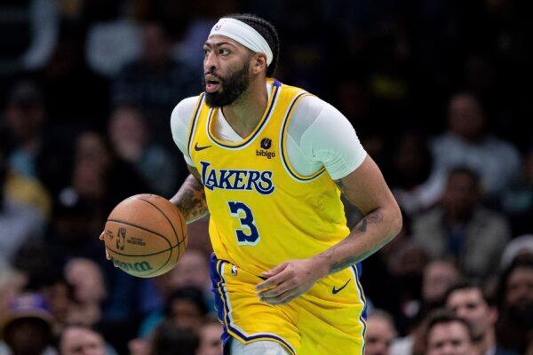 Los Angeles Lakers forward Anthony Davis brings the ball upcourt against the Charlotte Hornets during the second half of an NBA basketball game in Charlotte on Feb. 5, 2024. (Jacob Kupferman/AP Photo)