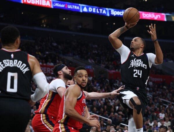 Norman Powell (24) of the LA Clippers attempts a shot in front of CJ McCollum (3) and Larry Nance Jr.(22) of the New Orleans Pelicans during a win in in Los Angeles on Feb. 7, 2024. (Harry How/Getty Images)