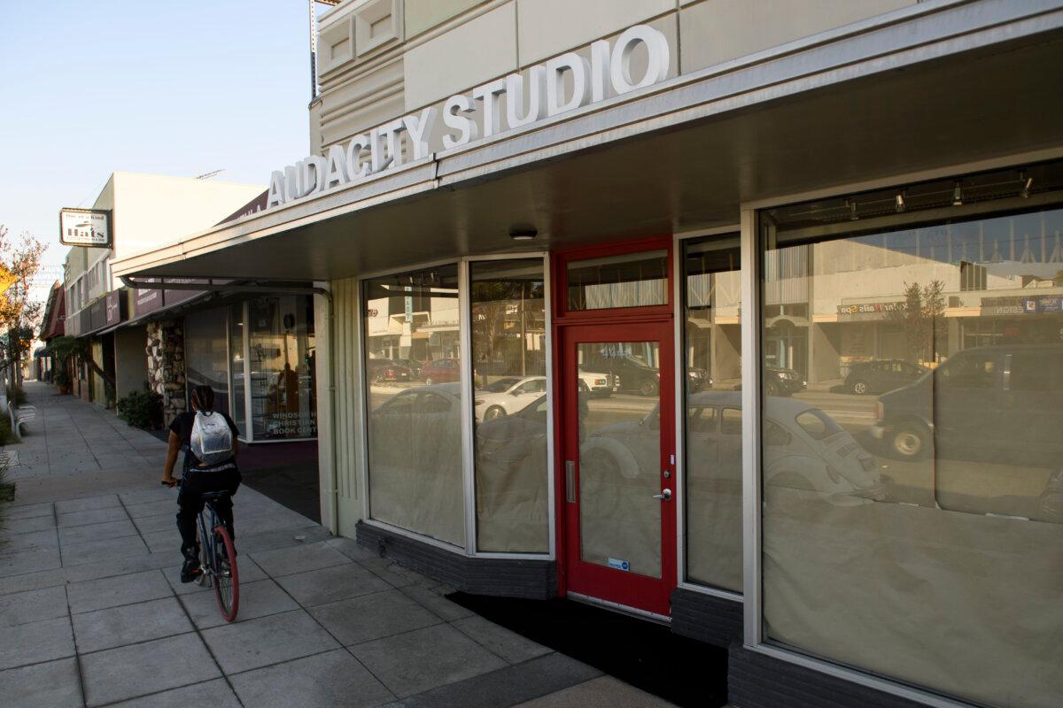 The closed Audacity Studio men's clothing store and barbershop on Slauson Avenue in Los Angeles on Nov. 24, 2020. (Patrick T. Fallon/AFP via Getty Images)