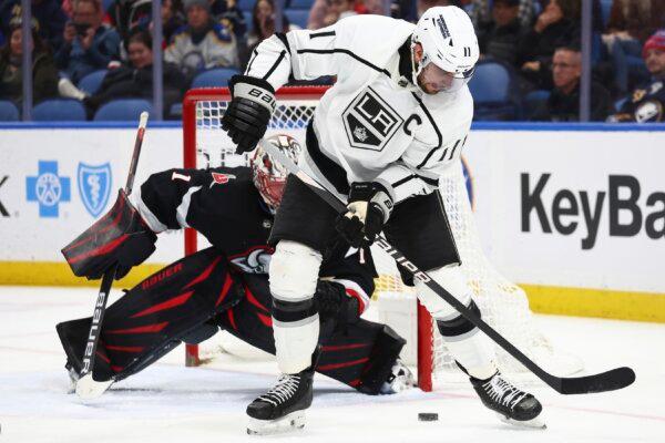 Los Angeles Kings center Anze Kopitar (11) is stopped by Buffalo Sabres goaltender Ukko-Pekka Luukkonen (1) during the second period in Buffalo, N.Y. on Feb. 13, 2024. (Jeffrey T. Barnes/AP Photo)