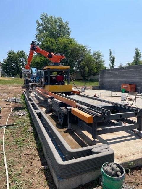 3D-printed concrete walls are laid with hollow spaces to leave room for insulation, plumbing, and electrical in Muscatine, Iowa in mid-2023. (Courtesy of Ziyou Xu of RIC Technology)
