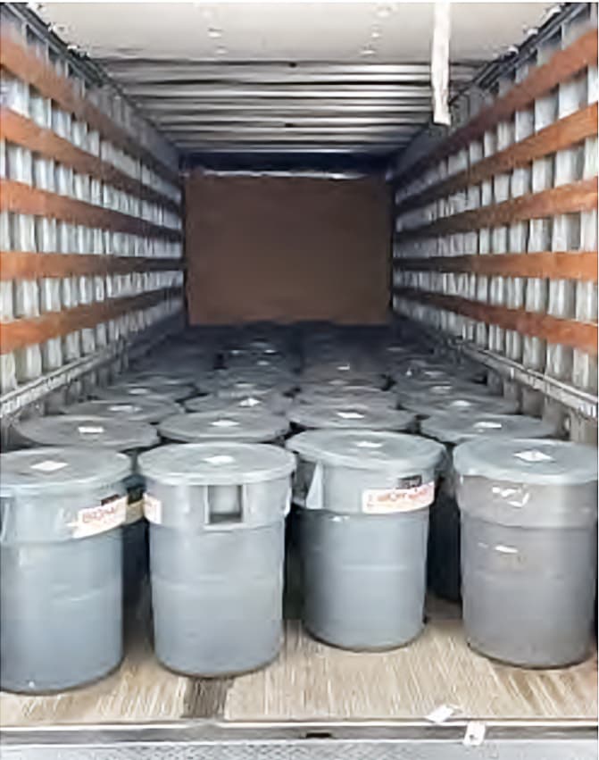 More than 40 trash can-sized containers of biohazardous waste were removed from the suspected illegal lab after its abatement, in Reedley, California. Officials said they had to dispose of more than 103 tons of general waste and 448 gallons of medical and biological waste. (City of Reedley)