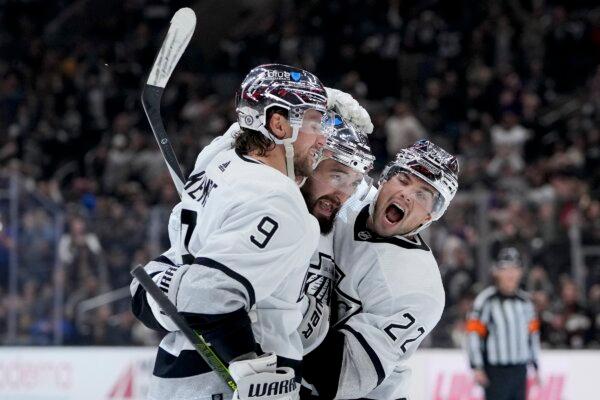 Los Angeles Kings defenseman Drew Doughty (C) celebrates his goal against the Anaheim Ducks with right wing Adrian Kempe (L) and left wing Kevin Fiala during the second period of an NHL hockey game in Los Angeles on Feb. 24, 2024. (Ryan Sun/AP Photo)